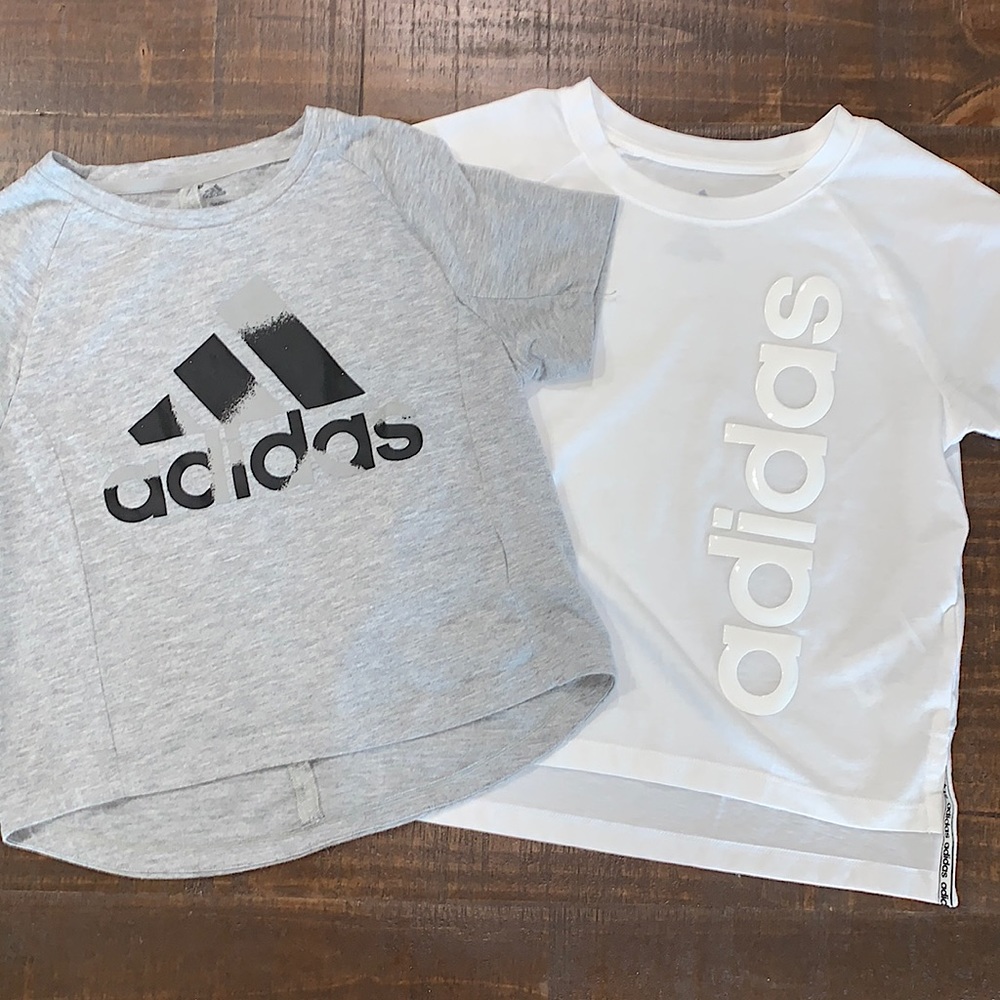Two cropped Adidas shirts